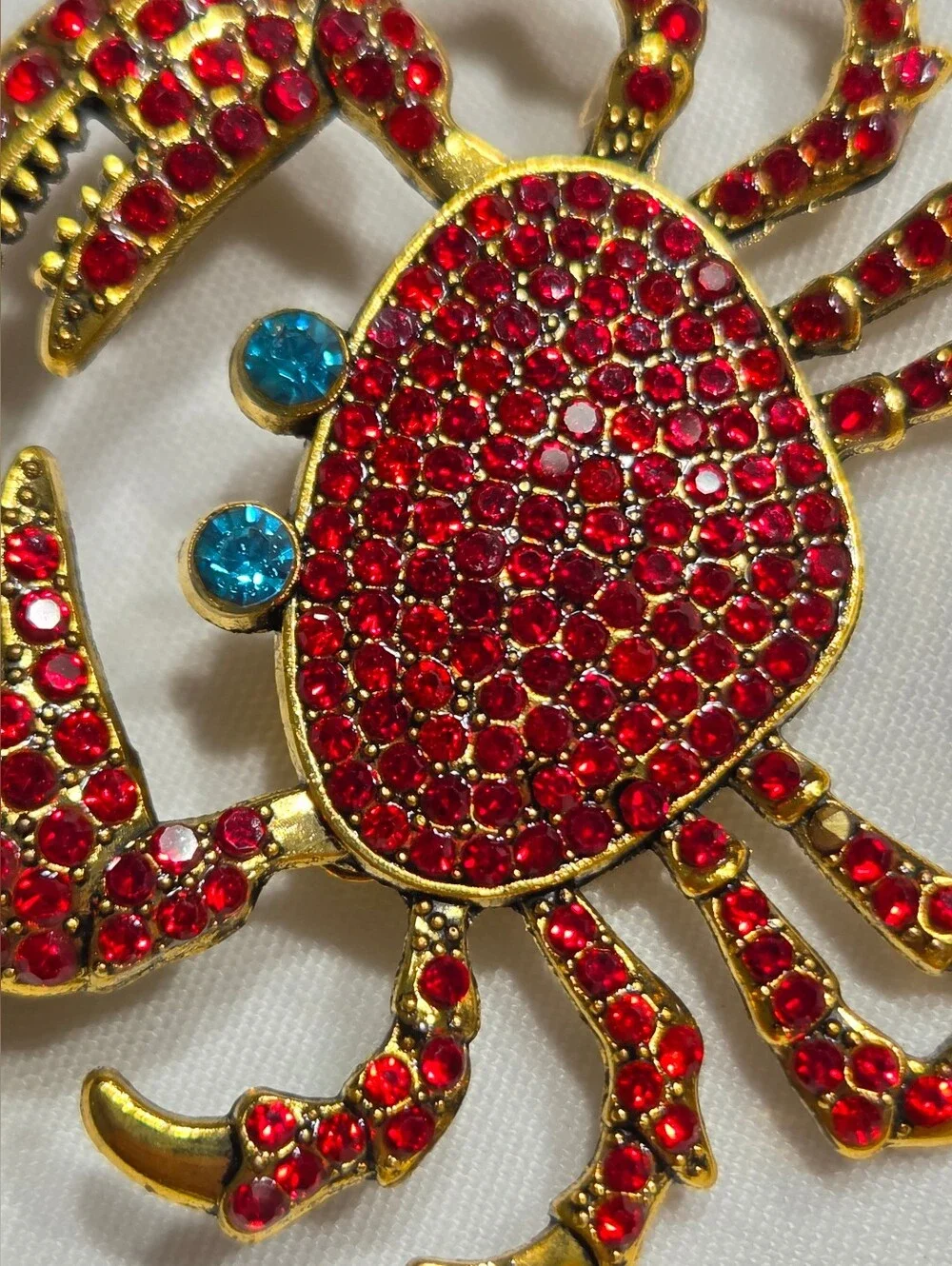 Gold-Tone Red Crystal Crab Brooch with Blue Accents